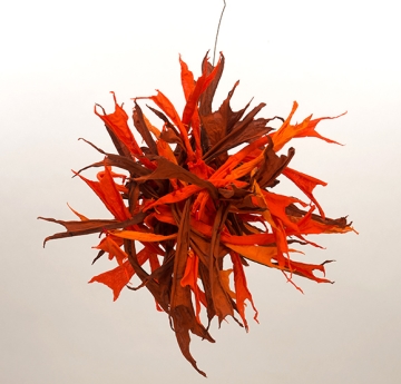 A red, hanging, fiber sculpture