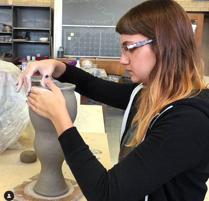 Student working on a ceramics piece